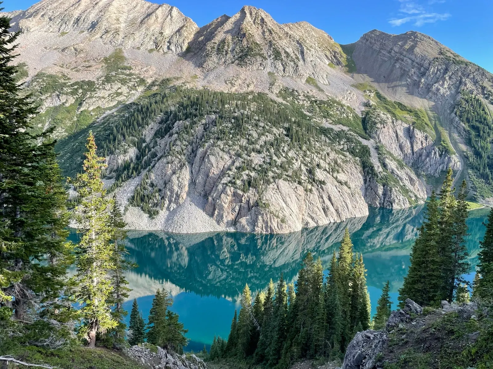 Source photo: turquoise alpine lake beneath granite peaks (the maker's own photo).