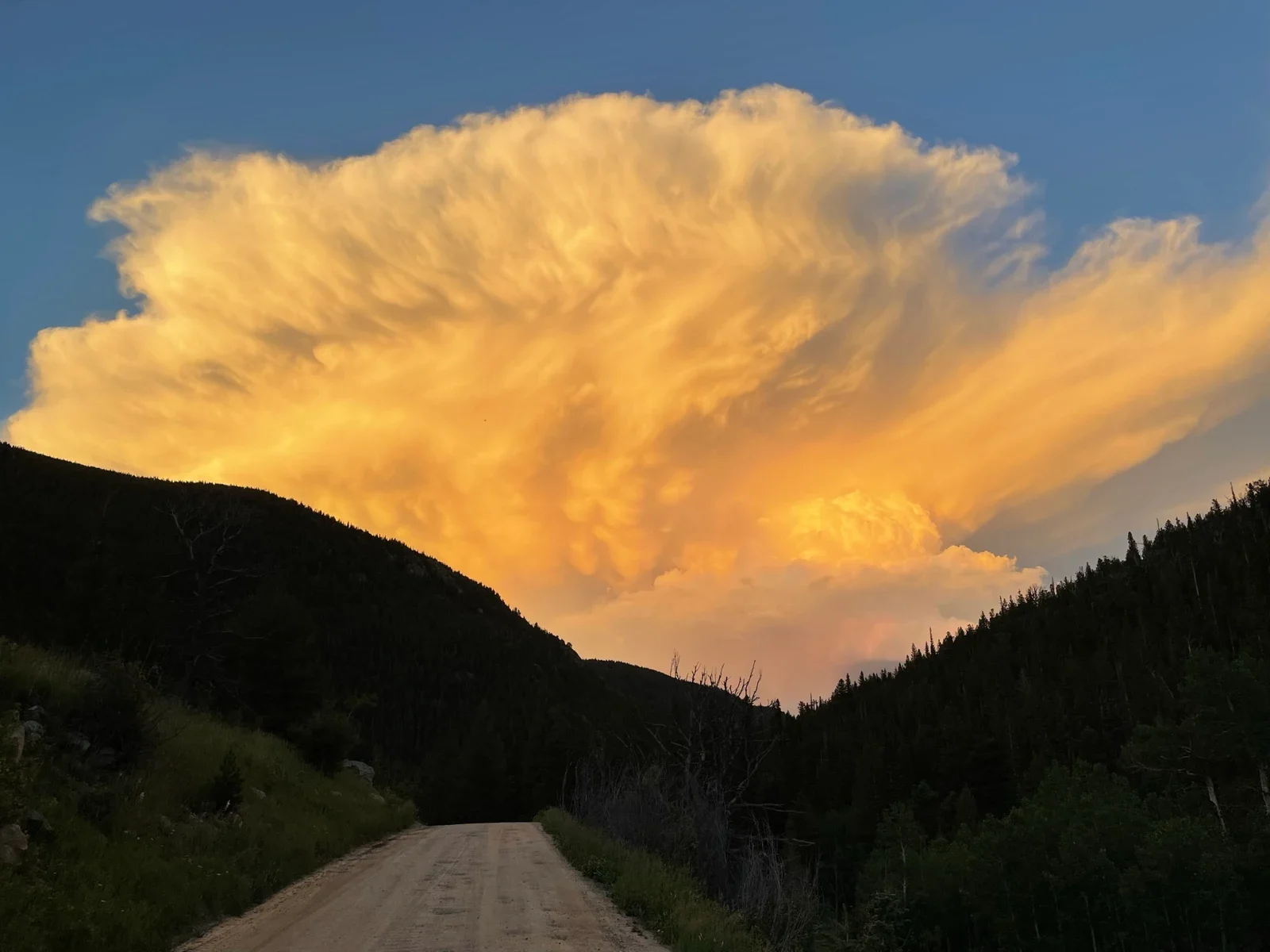 Source photo: a golden thunderhead over a dark ridge (the maker's own photo).